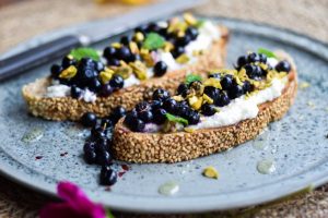 Ricotta toast with wild blueberries is a healthy breakfast