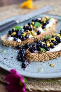 Nordic Ricotta toast with wild blueberries and pistachios